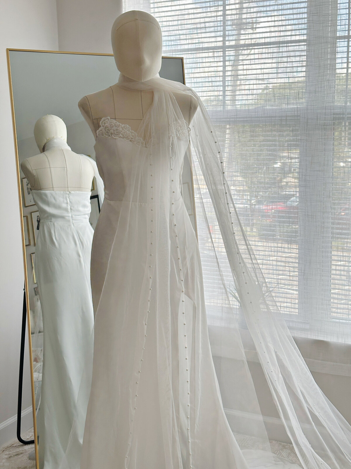 Modern cathedral length bridal scarf offering a delicate shimmer from hand sewn pearls
