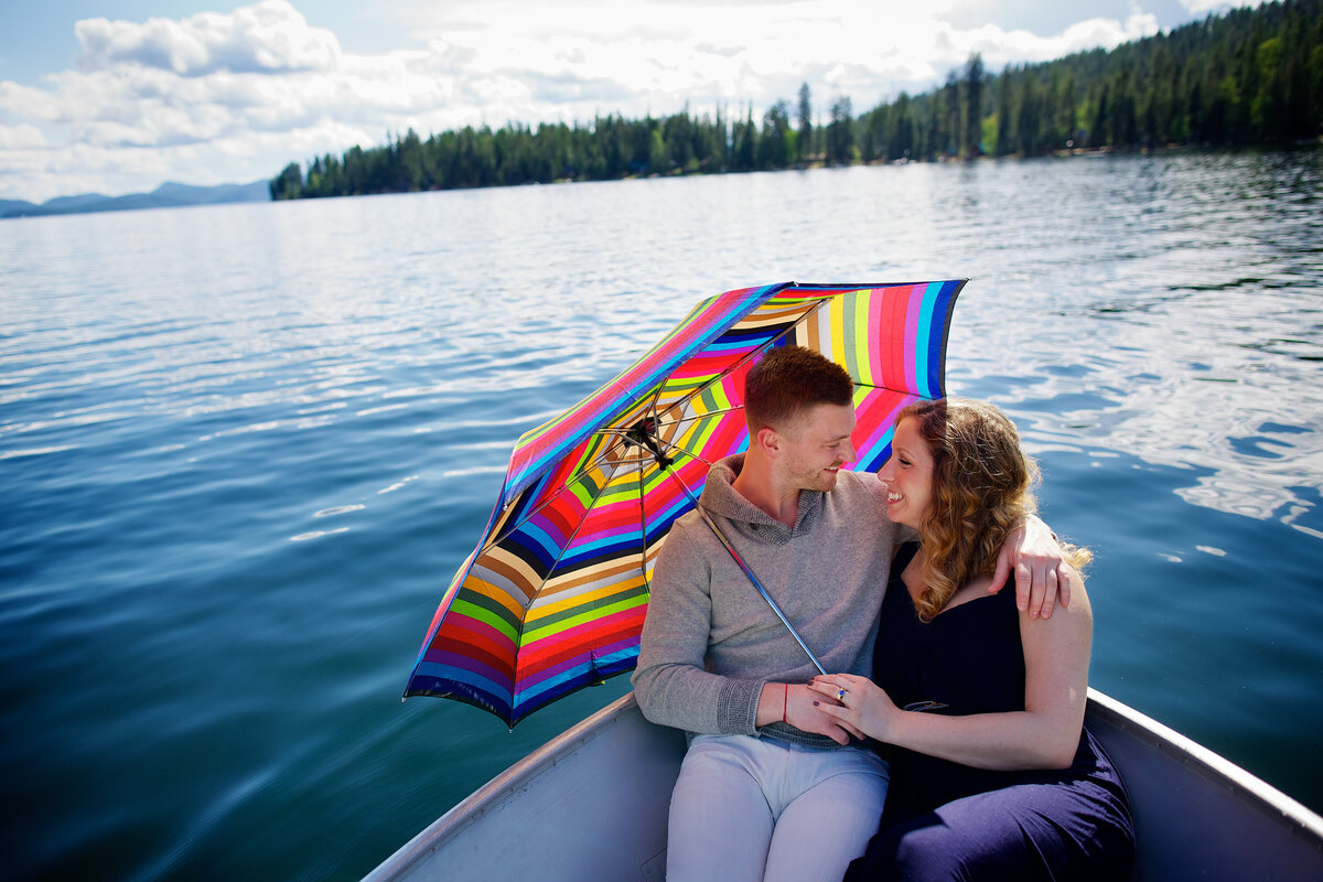 boat-umbrella-lake-engagement-portrait-coeur-dalene