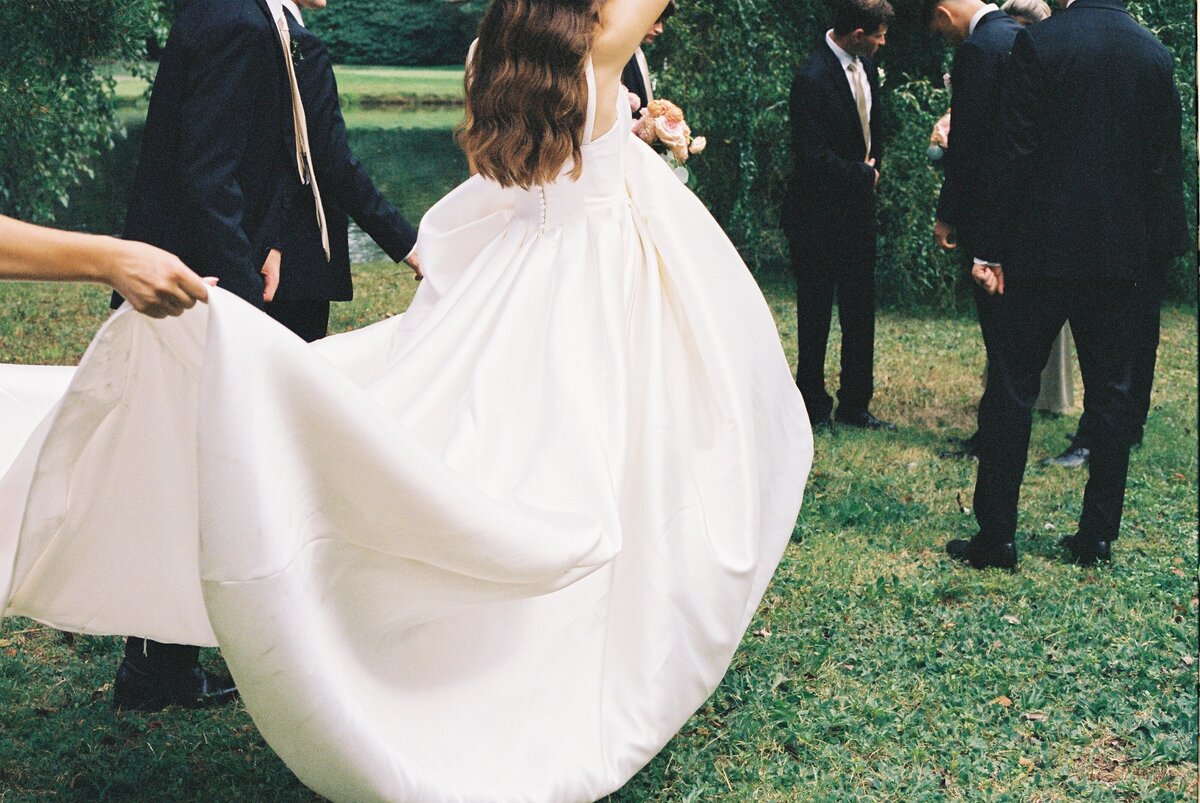 bride approaching groomsmen