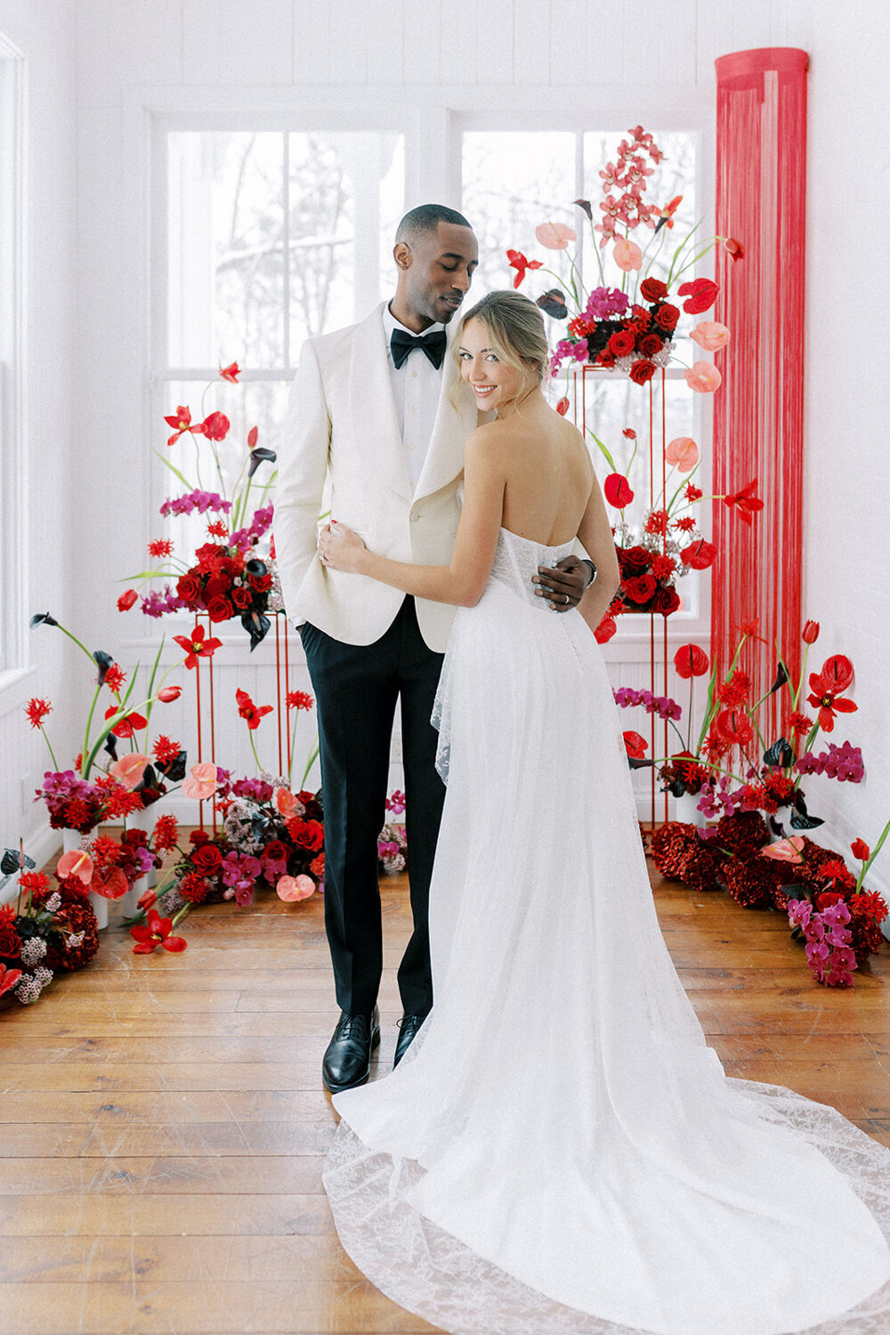 couple-wedding-ceremony-modern-red-flowers