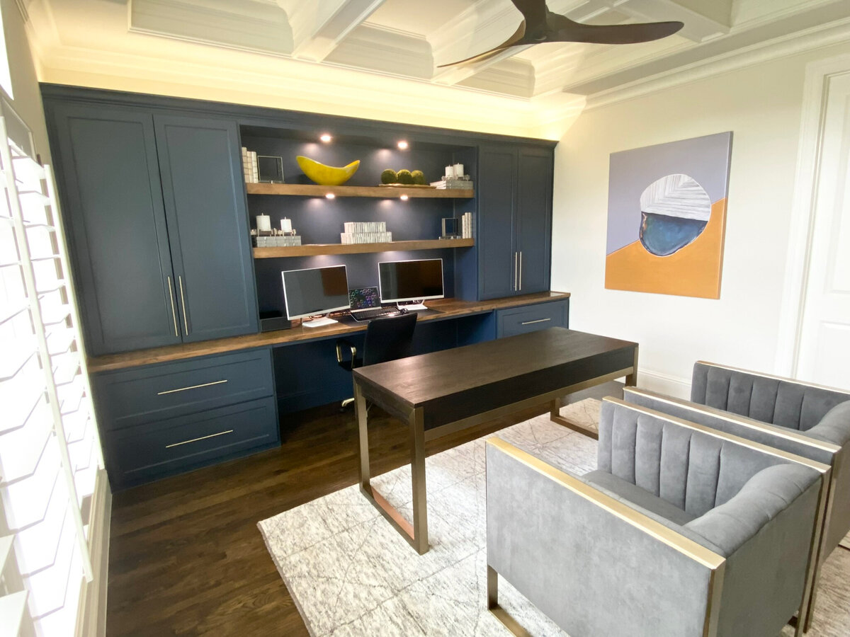 Interior design tailored to home for a home office, featuring blue-colored accents, modern furnishings, and a professional, calming atmosphere ideal for work and productivity.