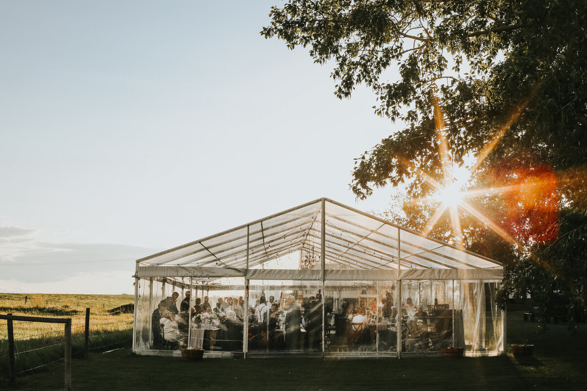 Outdoor reception tent at The Gathered, a nostalgic greenhouse based in Kathryn, Alberta wedding venue, featured on the Brontë Bride Vendor Guide.