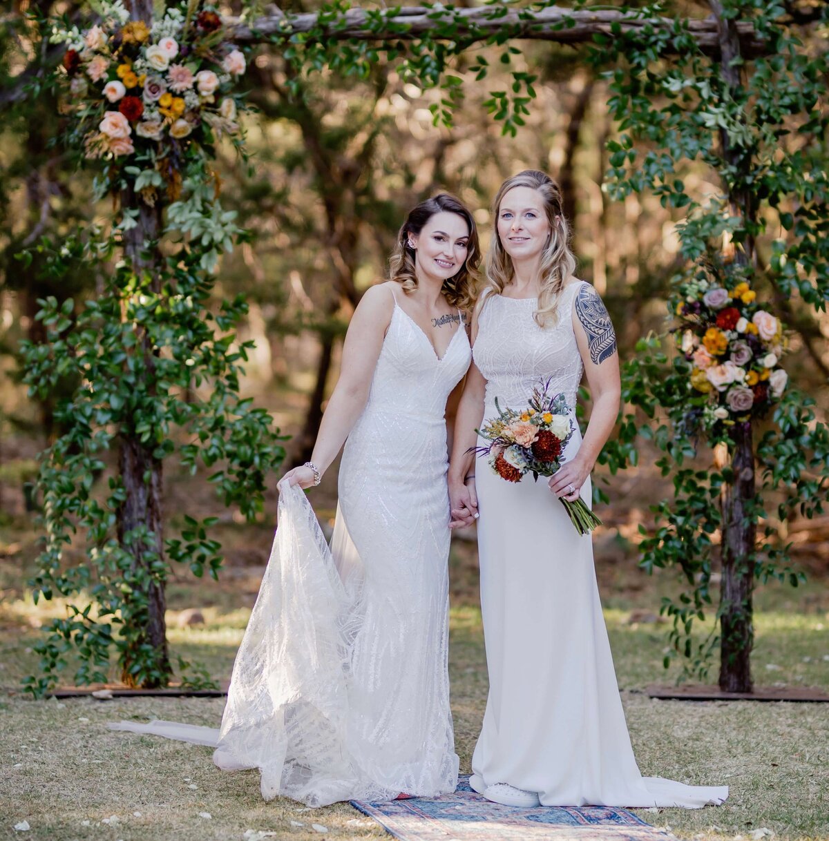 Elegant bridal hair and flawless wedding makeup by Mistique Makeup for this beautiful outdoor ceremony. From bold waves to soft half-up styles, both brides shine with professionally styled hair and camera-ready makeup. Perfect inspiration for same-sex weddings and wedding makeup in San Antonio or Austin. Trust Mistique for mobile bridal hair and makeup that celebrates your unique love story.