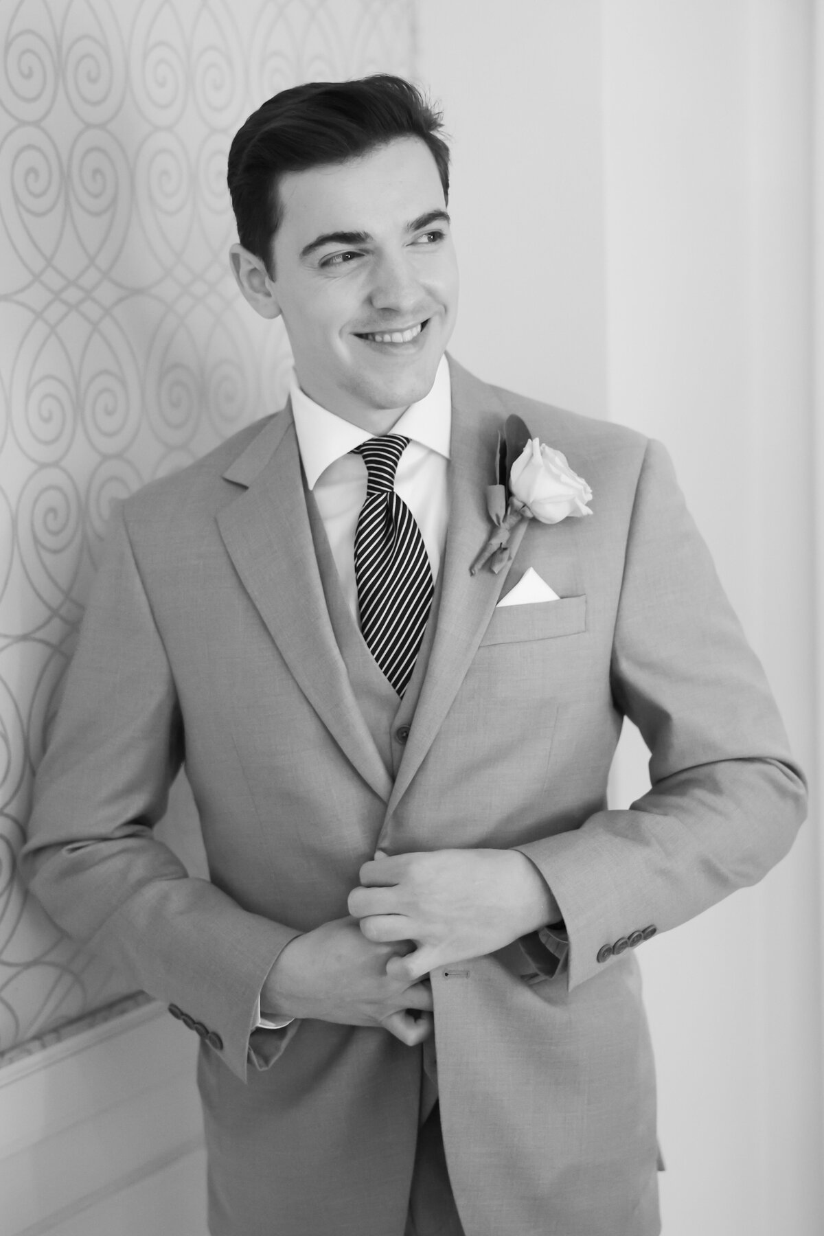 groom-buttoning-jacket