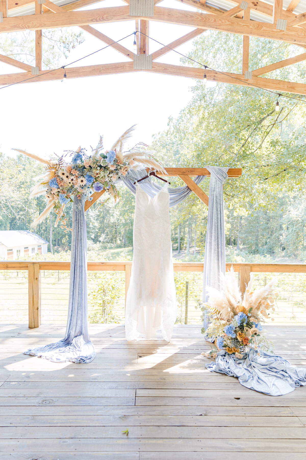 Ceremony centerpiece with wedding dress at vineyard wedding north georgia.