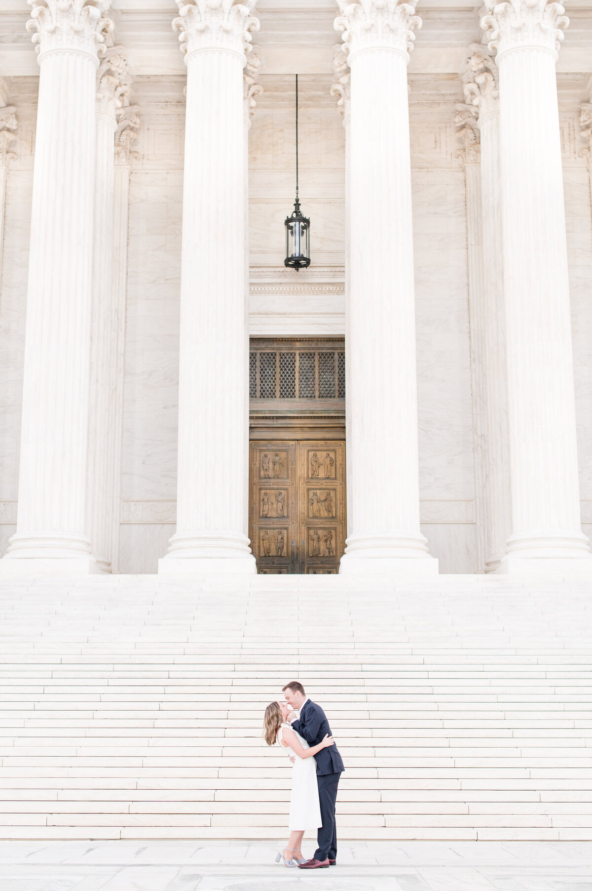 couple engagement at supreme court steps