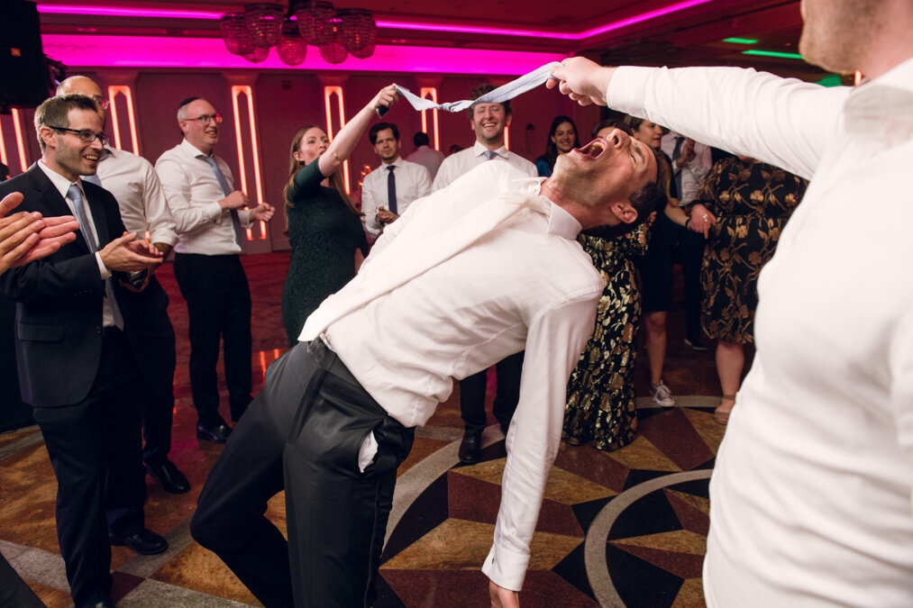 A man doing the limbo at his wedding