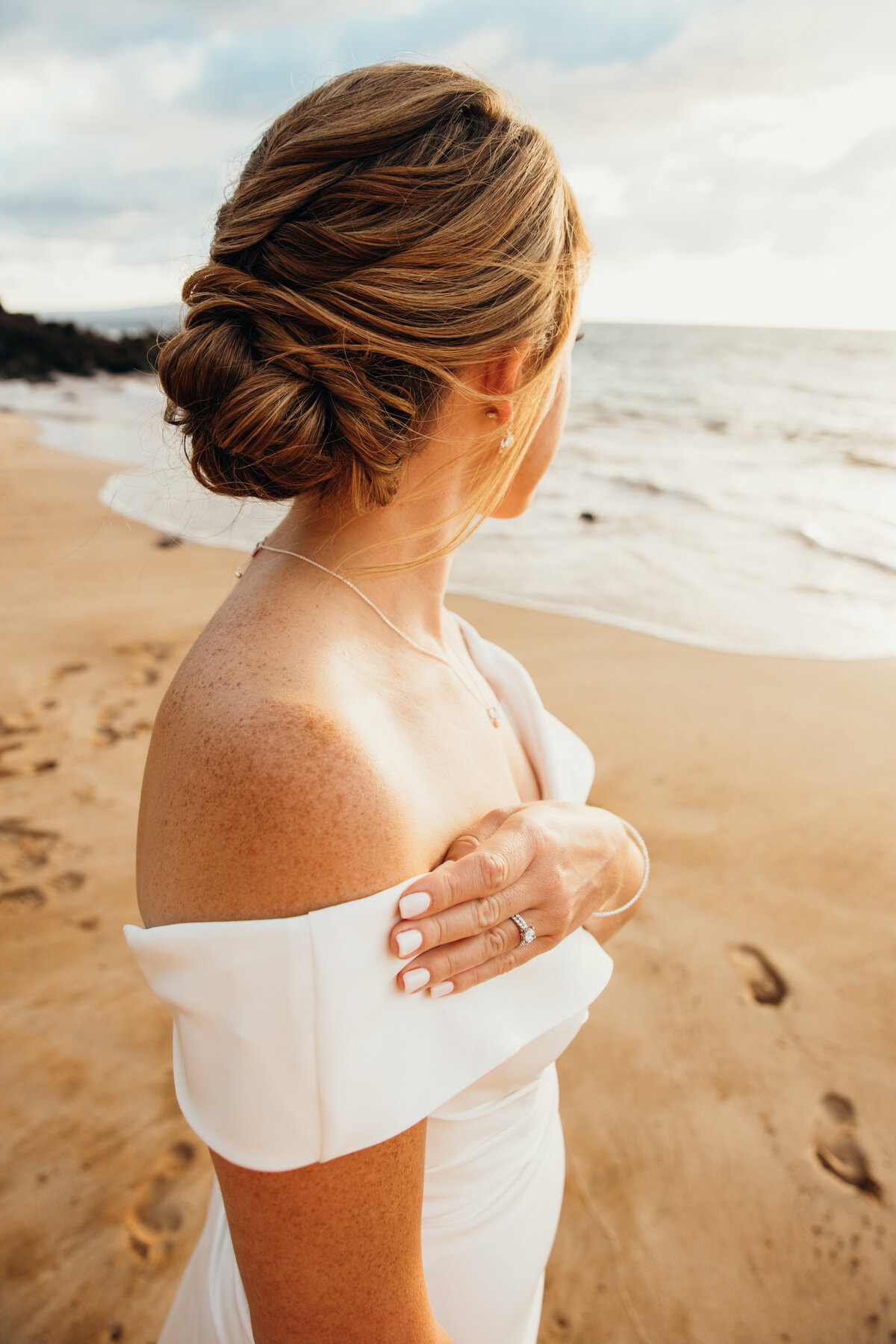 Maui Wedding Photographer captures bride with wedding ring on wedding dress