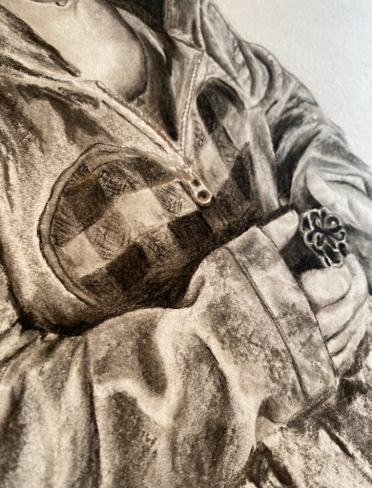 Pencil portrait of the jacket of a boy