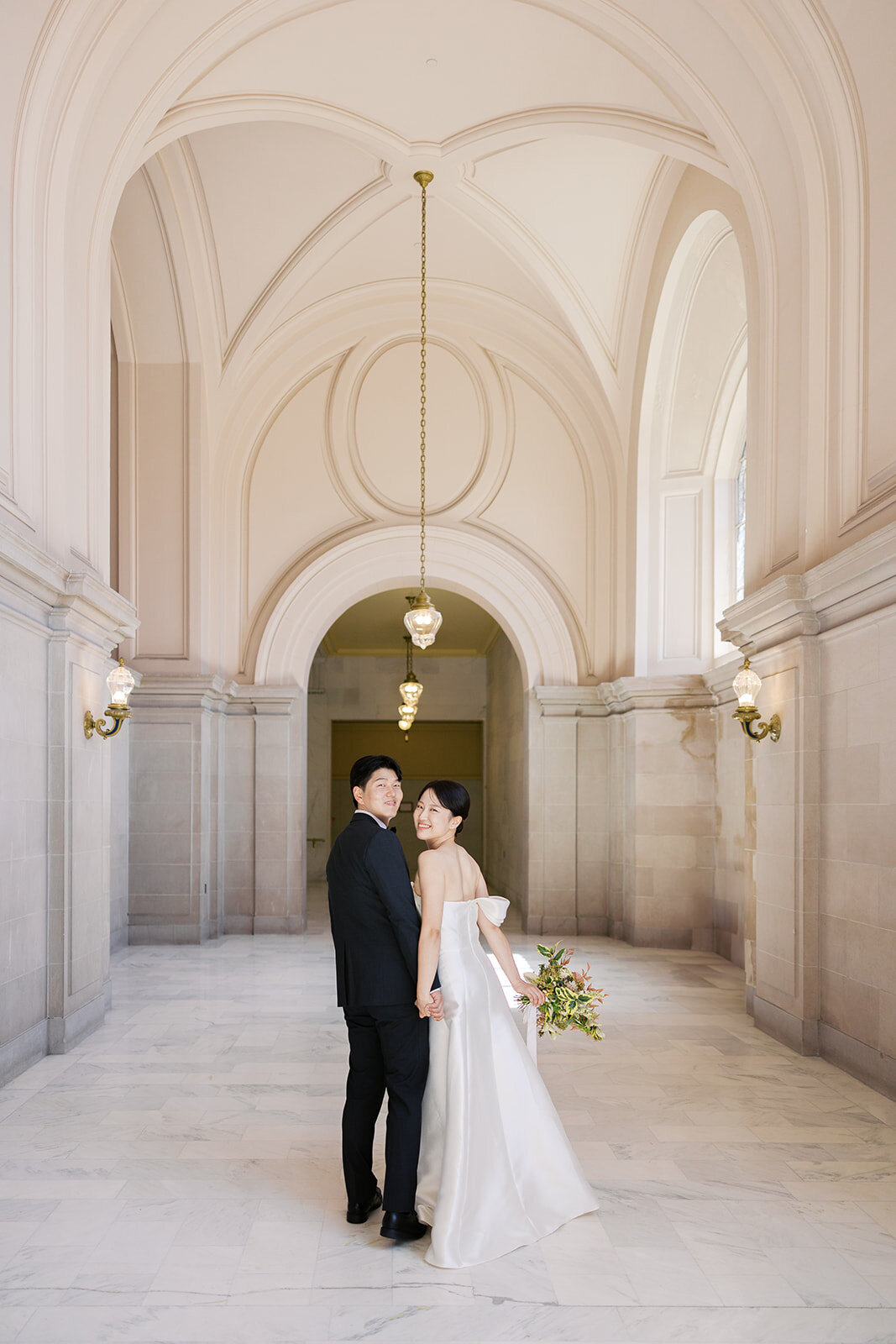 Couple walking San Francisco City Hall photography session