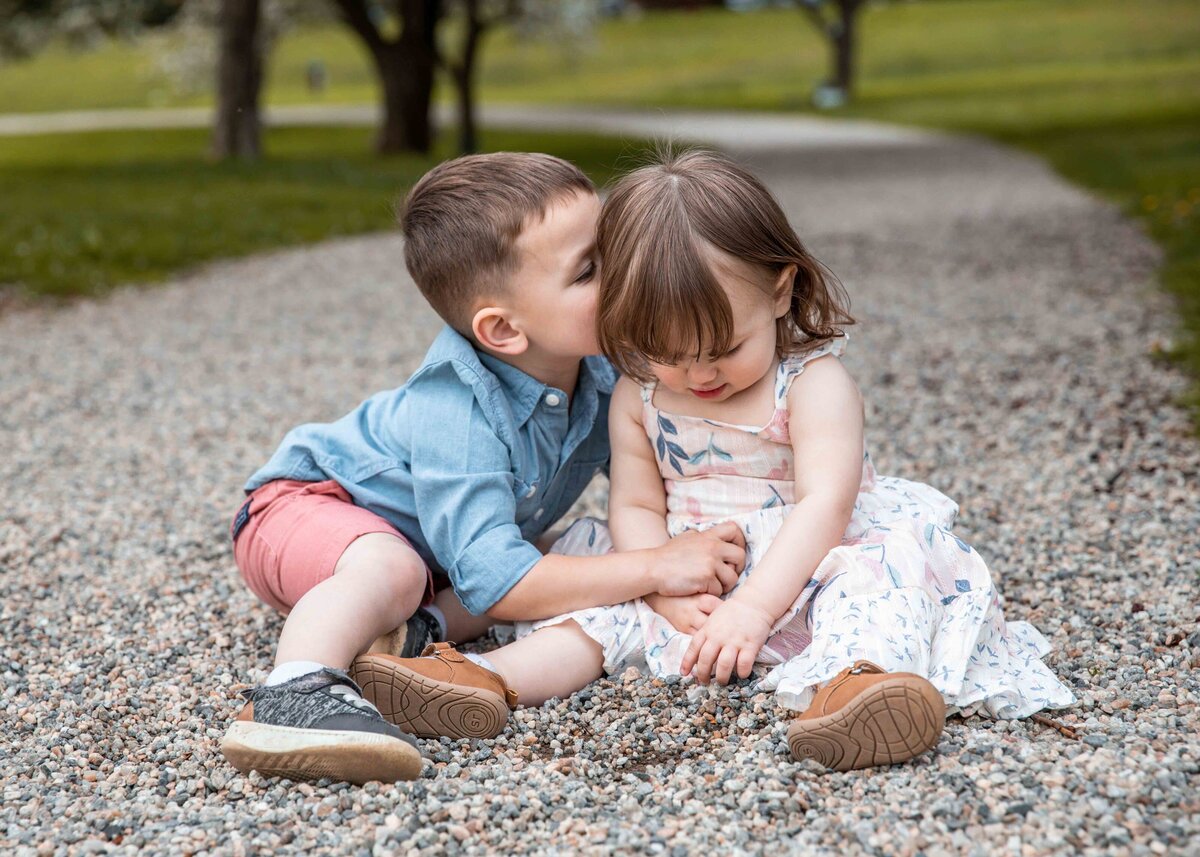 toddlers playing with rocks  during photo session in Connecticut