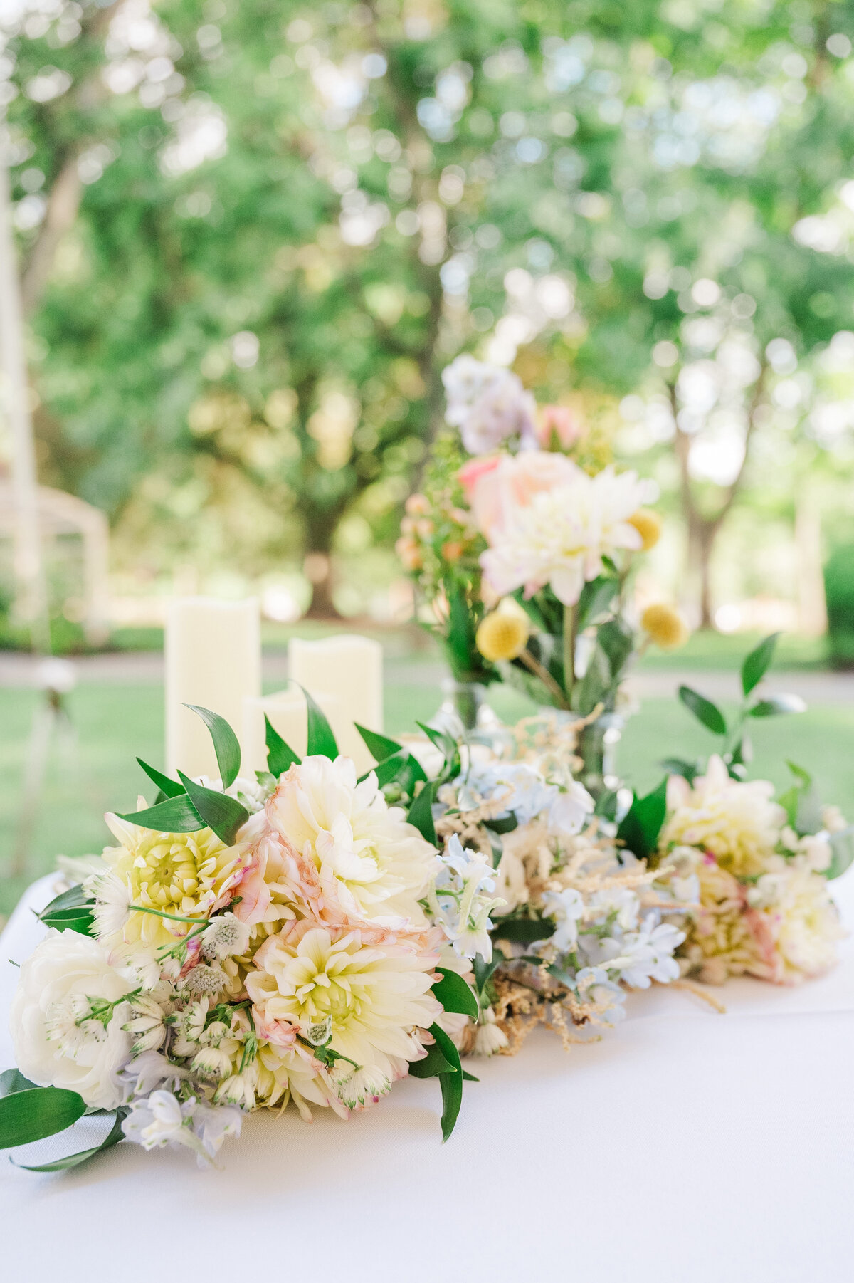 wedding flowers setup for a summer event in pittsburgh in an outdoor tent