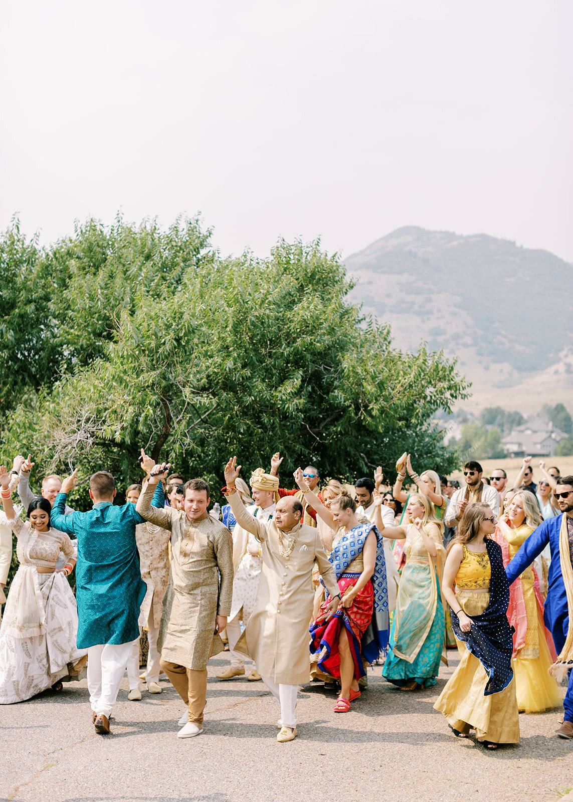 Traditional dancing at a South Asian Fusion wedding at an outdoor venue in Colorado