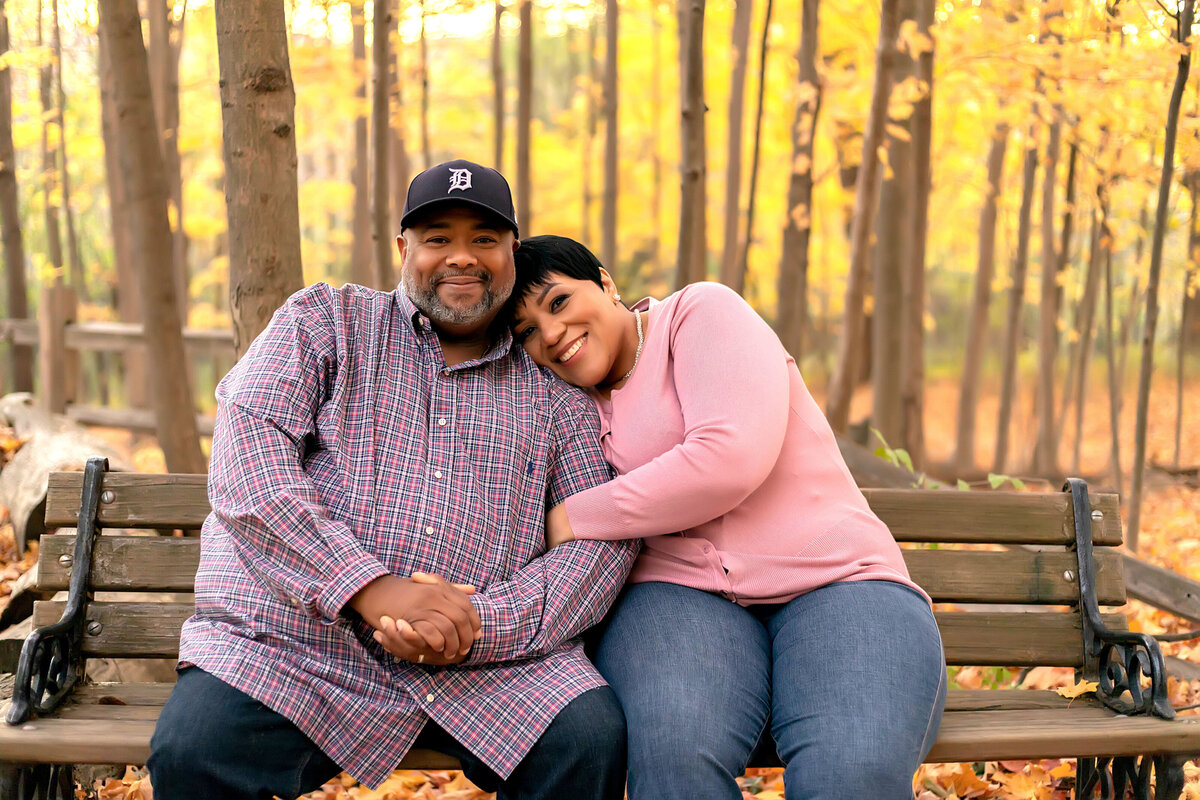 Couple sitting on bench at park