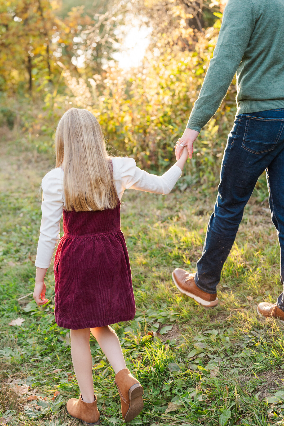 father and daughter holding hands