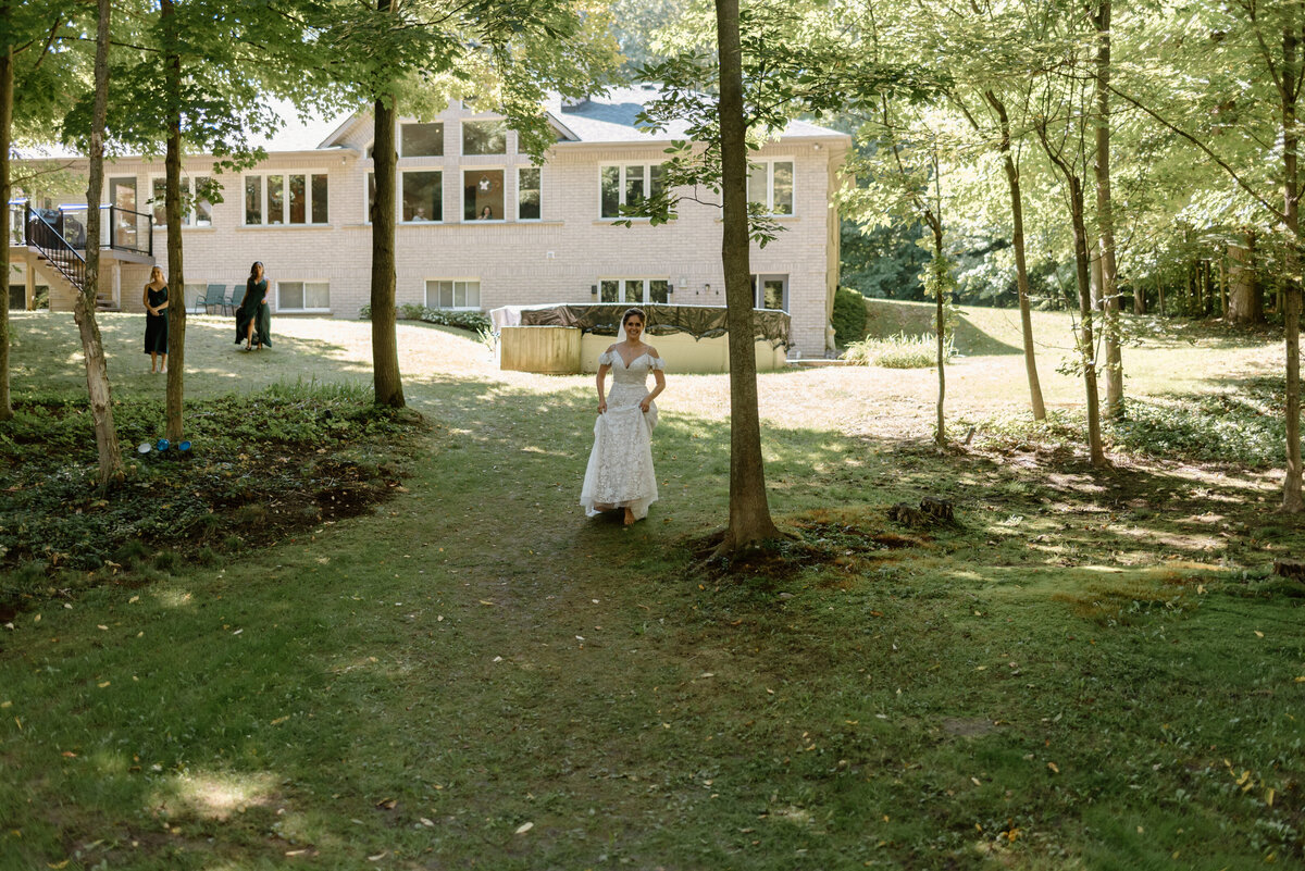 brantford ontario wedding bride walks towards her groom for first look
