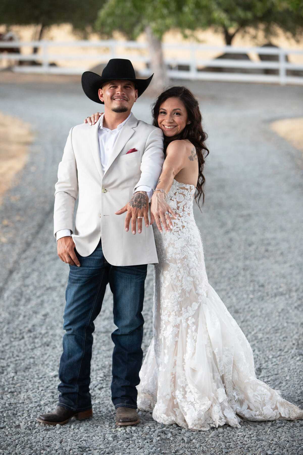 bride and groom showing rings