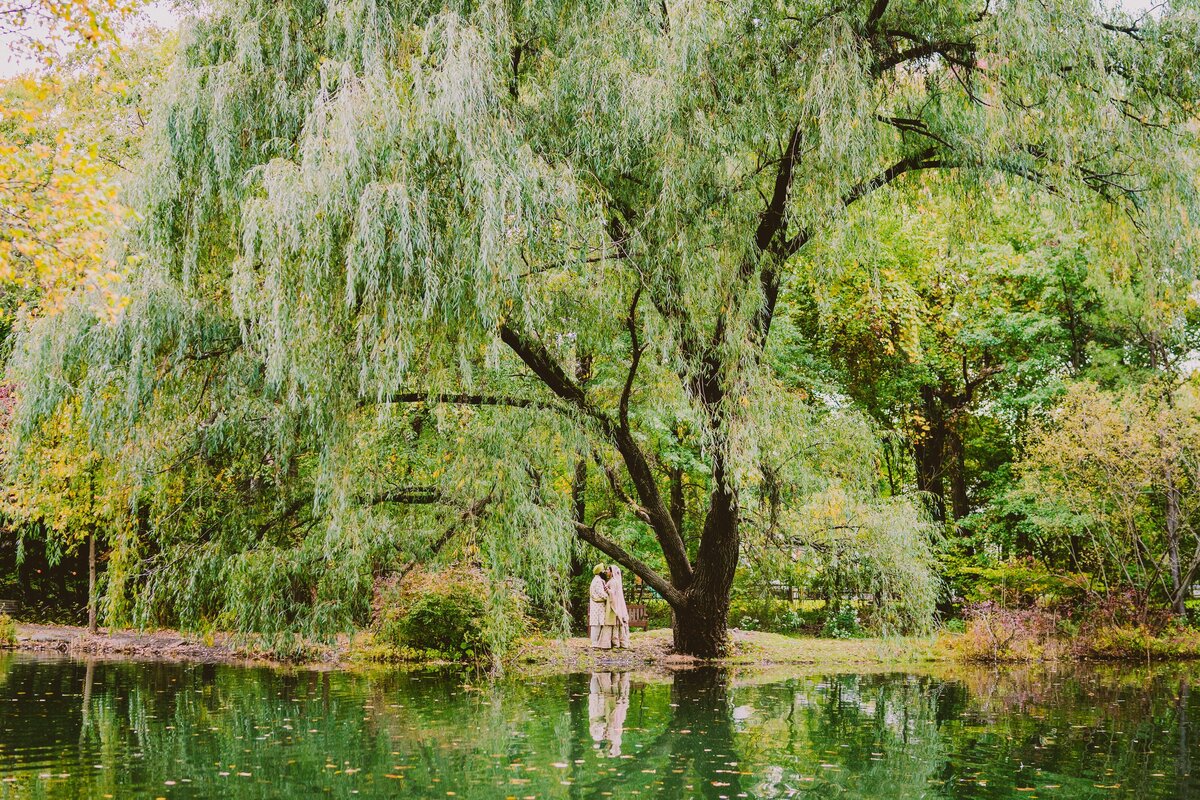A sikh couple share a moment from across the pond at the glen rock thielke arboretum in nj