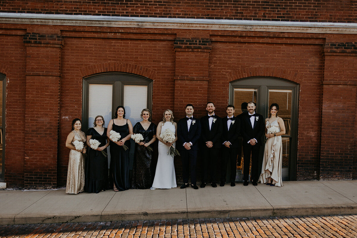 bride and groom with their wedding party in downtown Knoxville