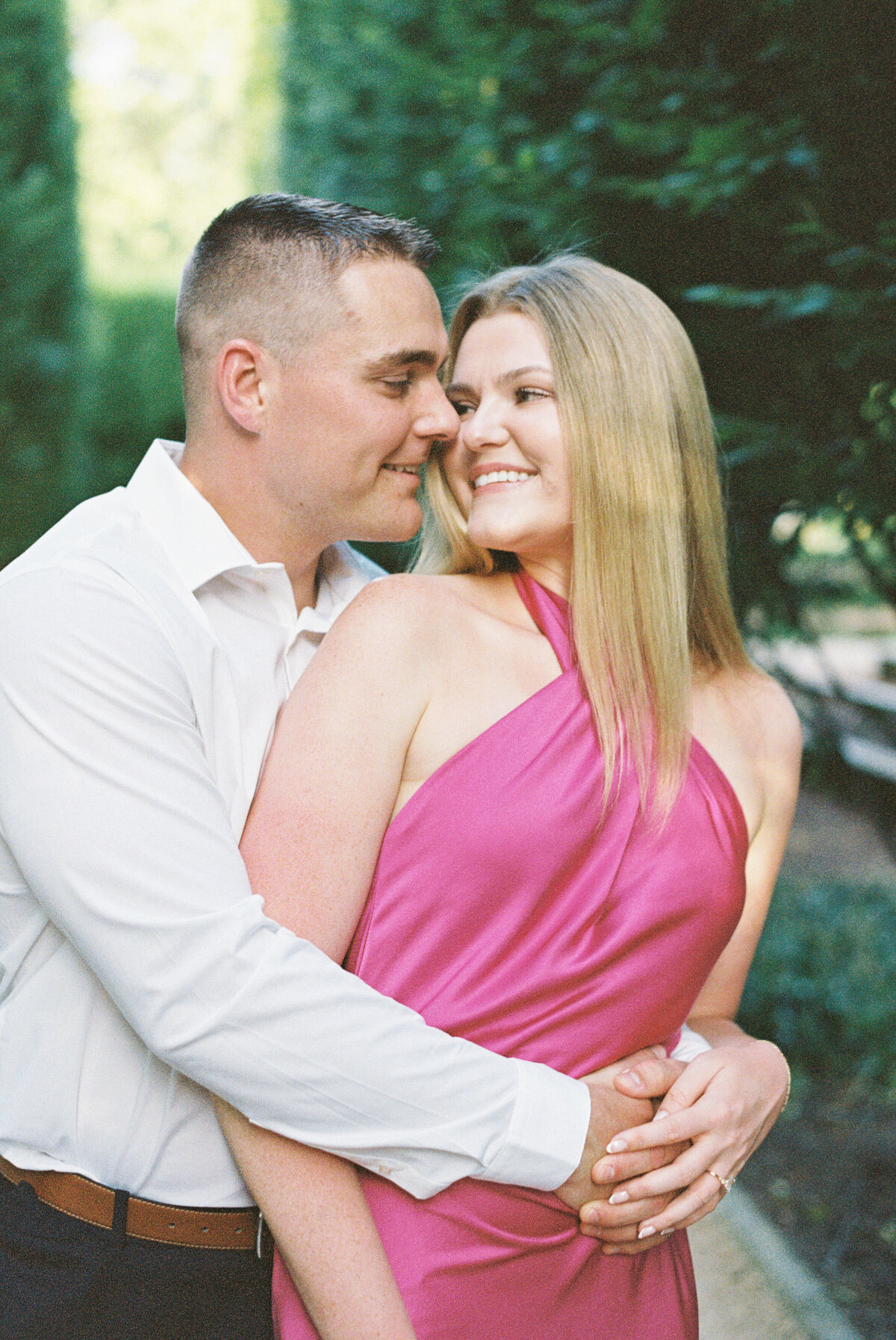 Engaged couple smiling in sunny Columbus session by Philadelphia photographer.