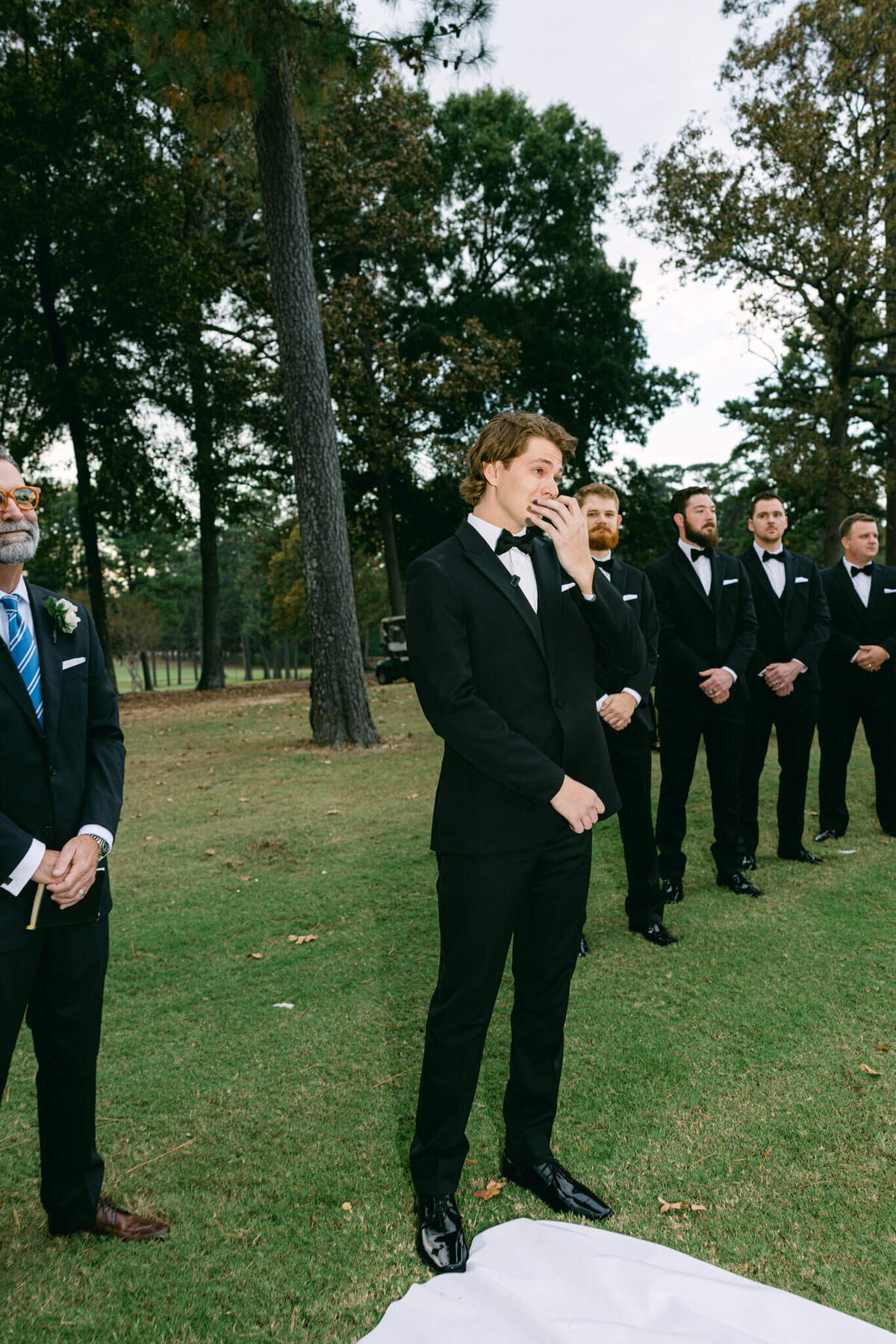 A wedding photo of the groom seeing his bride for the first time.