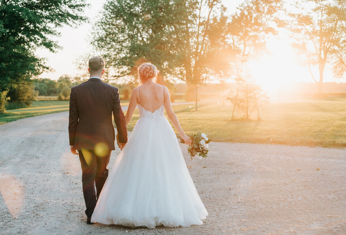 Glamorous sunset portraits of bride and groom at Willow Creek Barn by Nova Markina Photography