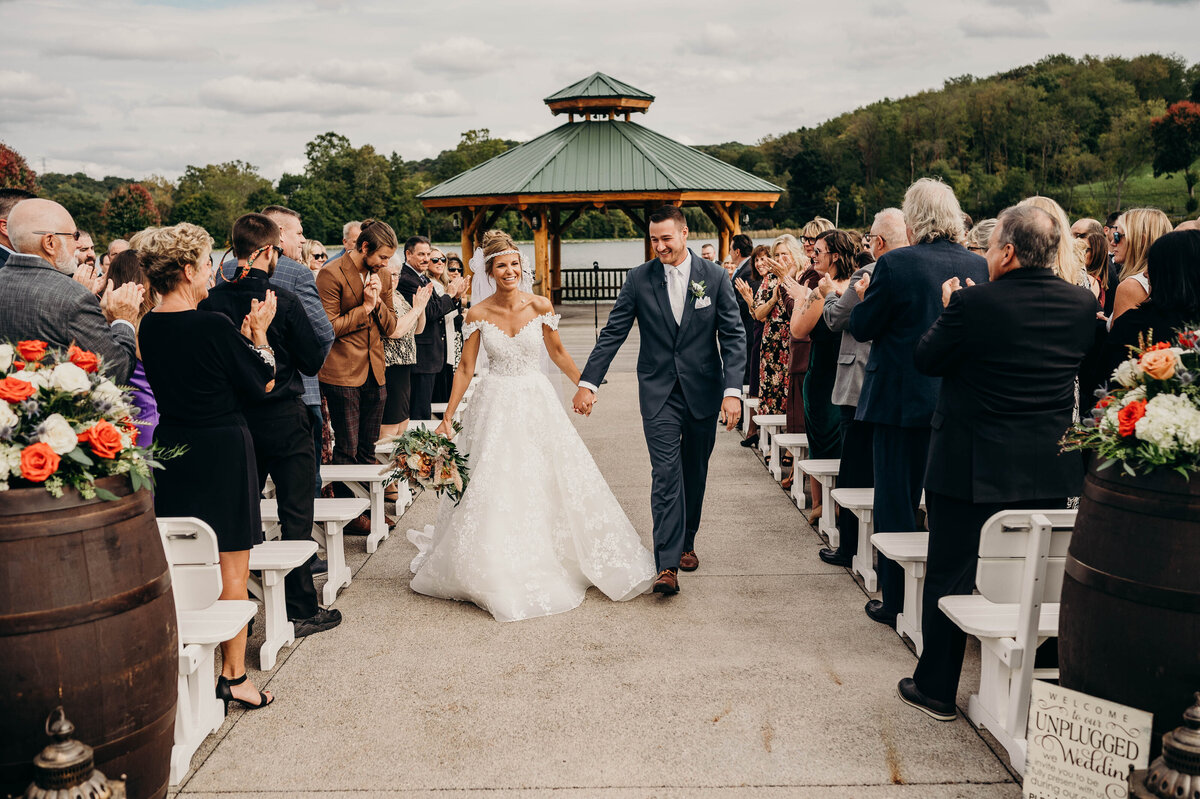 Bride and groom exchanging vows during their outdoor ceremony, surrounded by family and friends | Pittsburgh Wedding Photographer