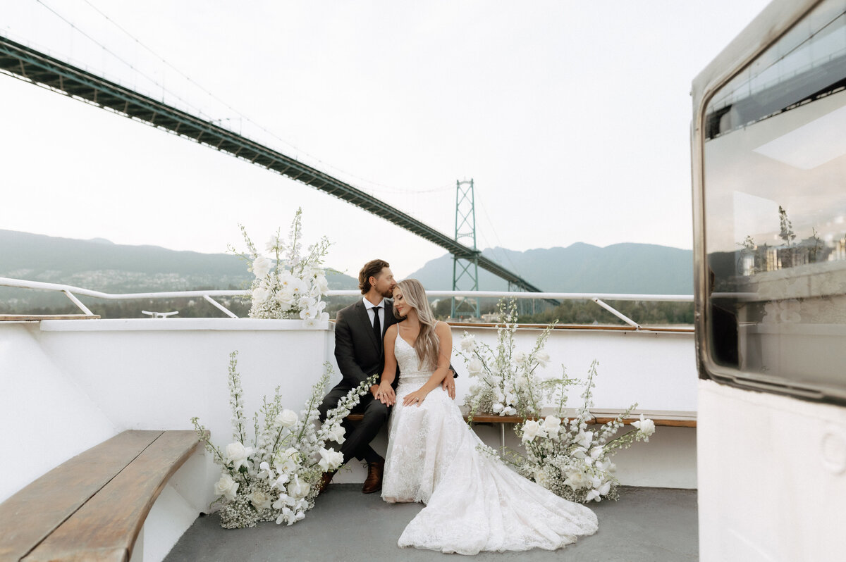 Vancouver yacht elopement with a couple under the Lions Gate Bridge