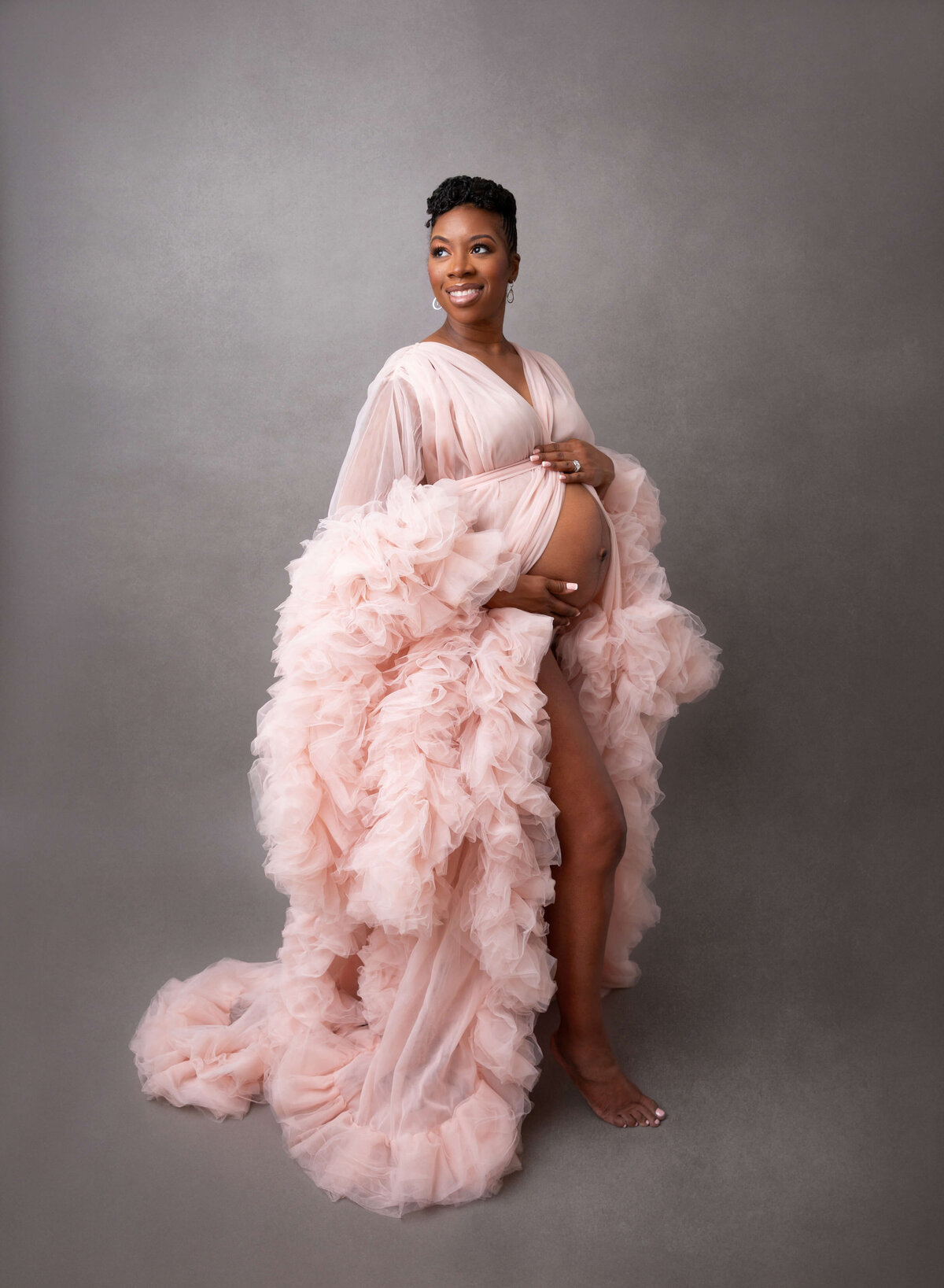 Elegant maternity photos in New York, beautifully captured by a top NYC maternity photographer, showcasing the joy of pregnancy