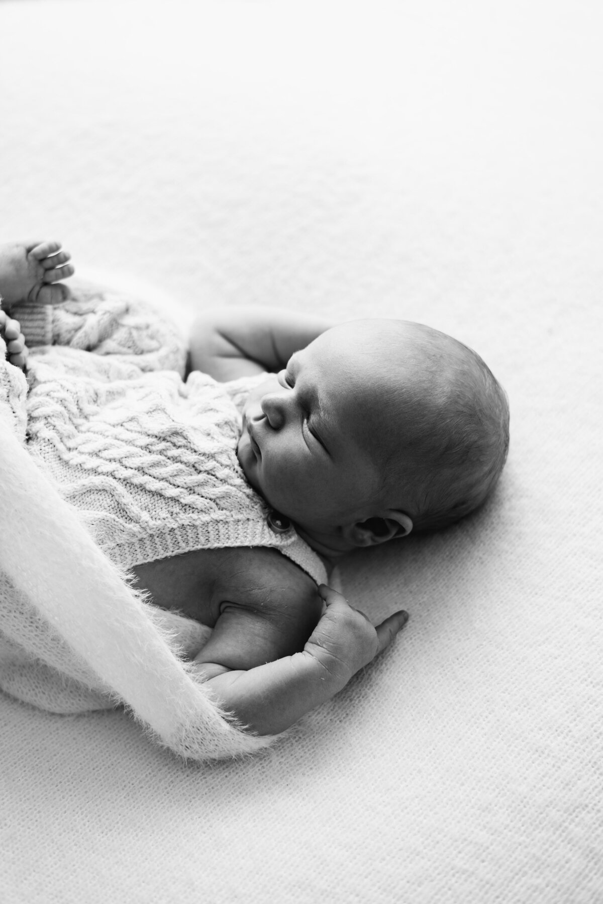Newborn baby sleeping at photoshoot in Billingshurst