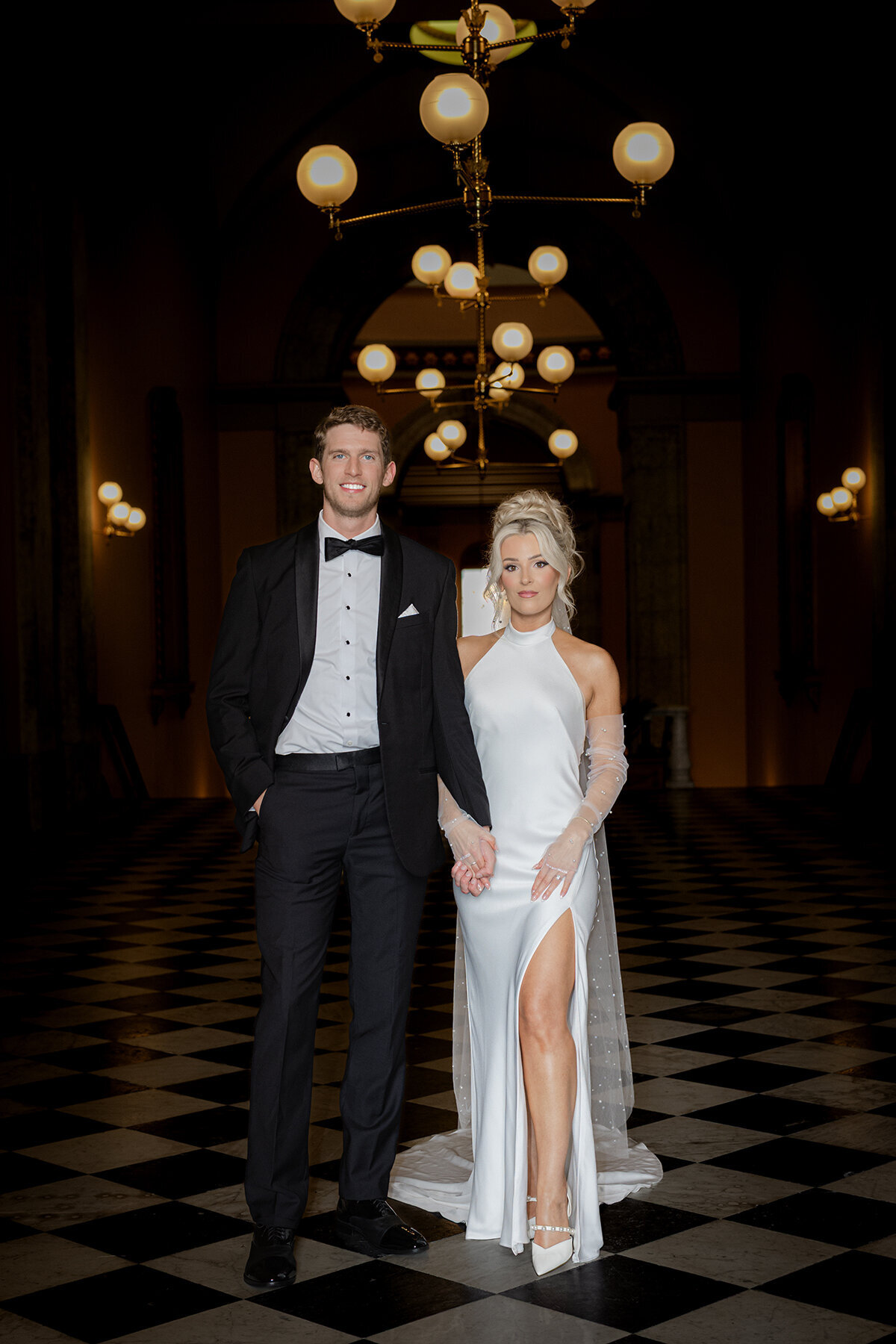 Luxury Columbus bride standing by a window, bathed in soft natural light with a clean and refined editorial feel at the Ohio Statehouse.