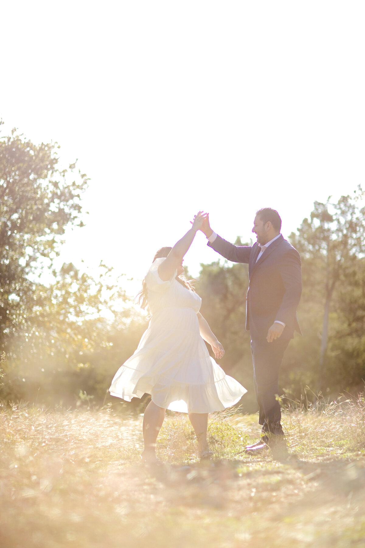 golden hour-engagement photos-dancing in field-golden hour-robin rogers photography-government canyon