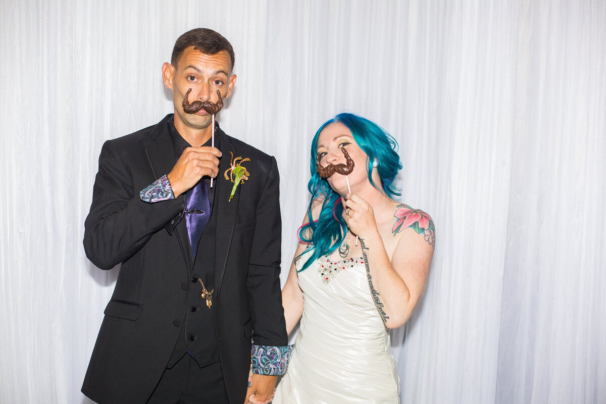 23 - Dali Museum St. Pete Wedding Bride & Groom with Chocolate Mustaches - Tampa Bay Wedding Planner