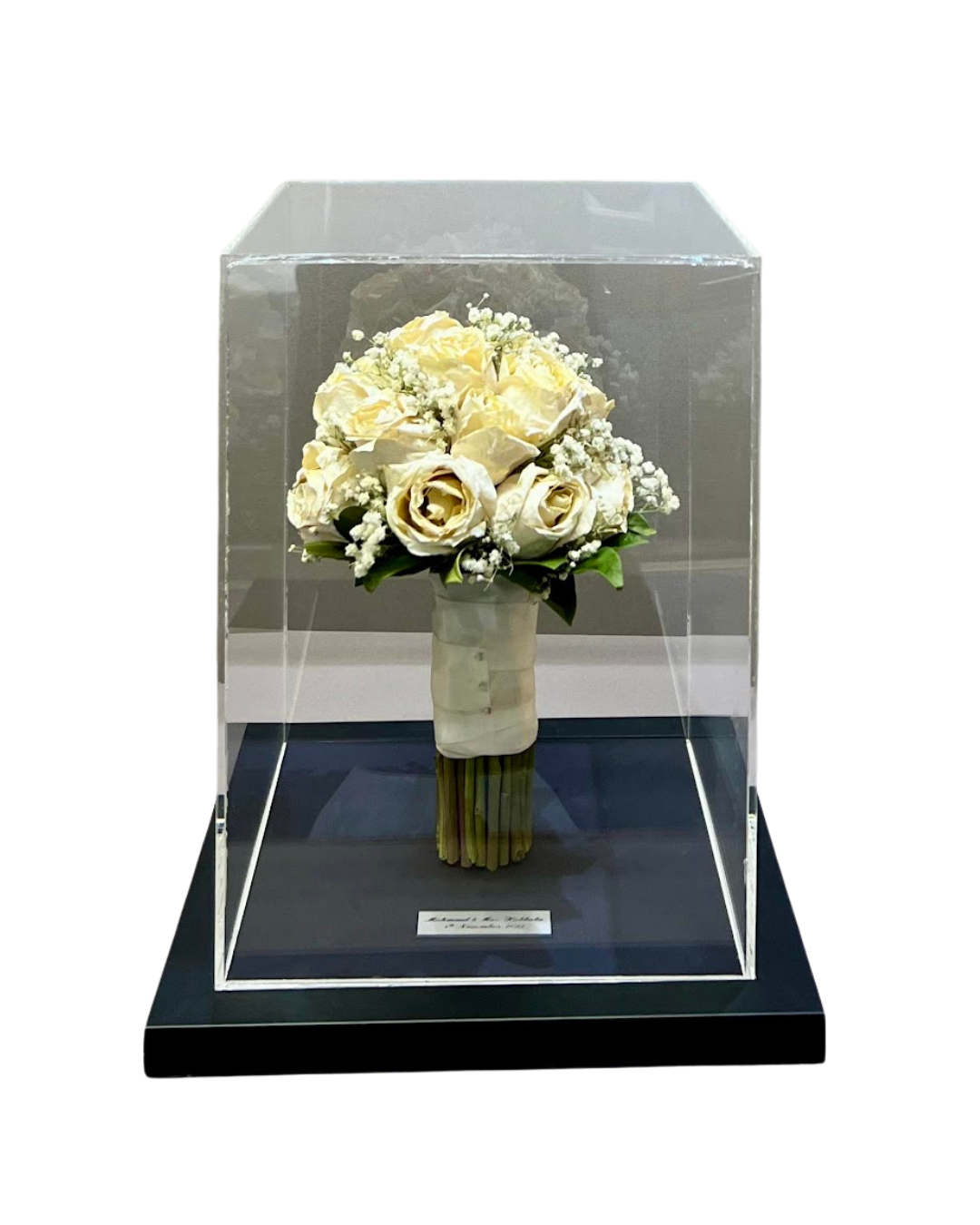 Wedding bouquet preserved inside perspex keepsake.