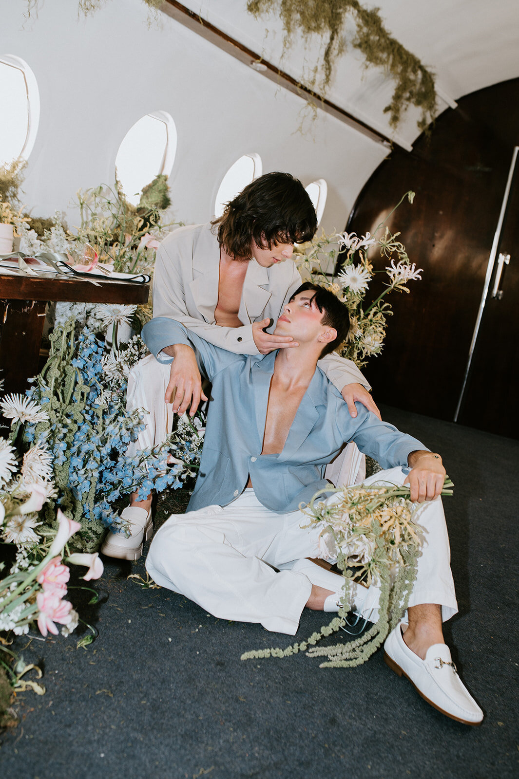 Grooms-beside-flowers