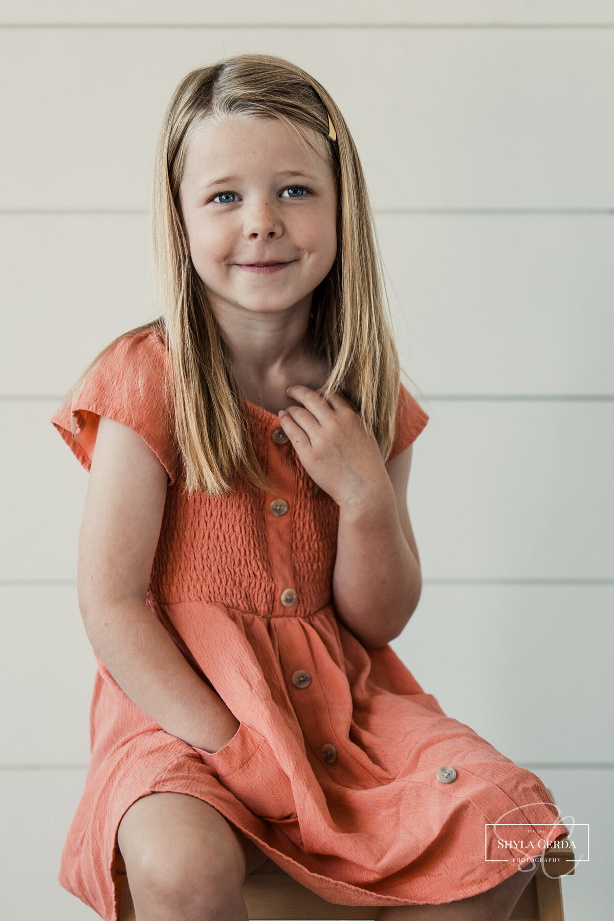 Girl smiling at camera during studio session