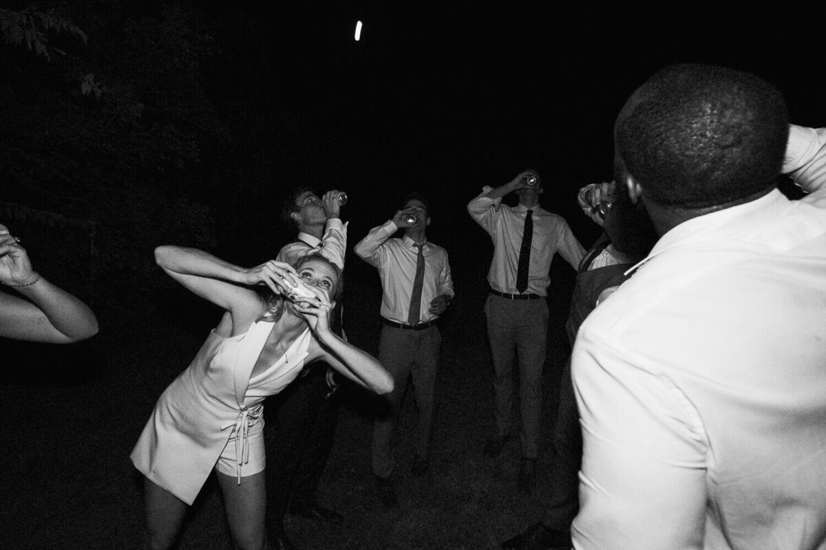 bride-and-groomsmen-shotgunning-beers