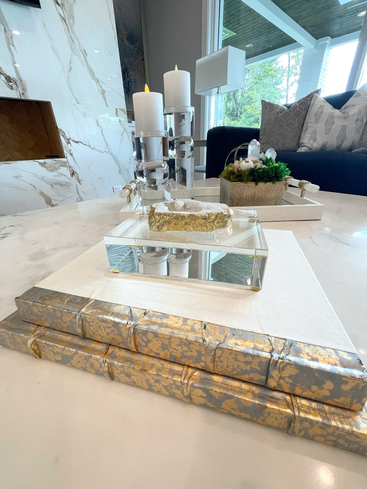 Luxury home interior contractor featuring a central living room table with elegant gold decoration, harmonizing the space with a sophisticated and stylish touch.