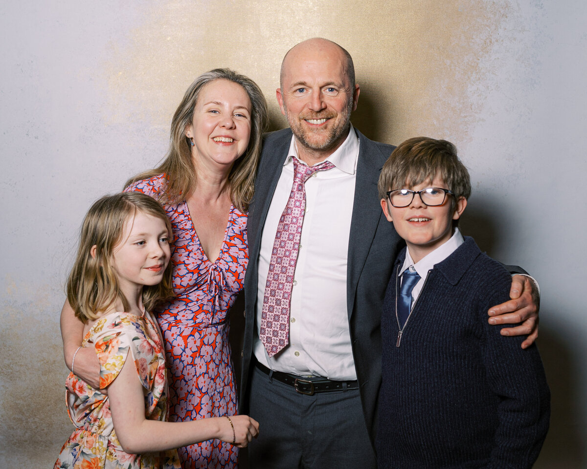Family in in wedding portrait studio wedding photobooth