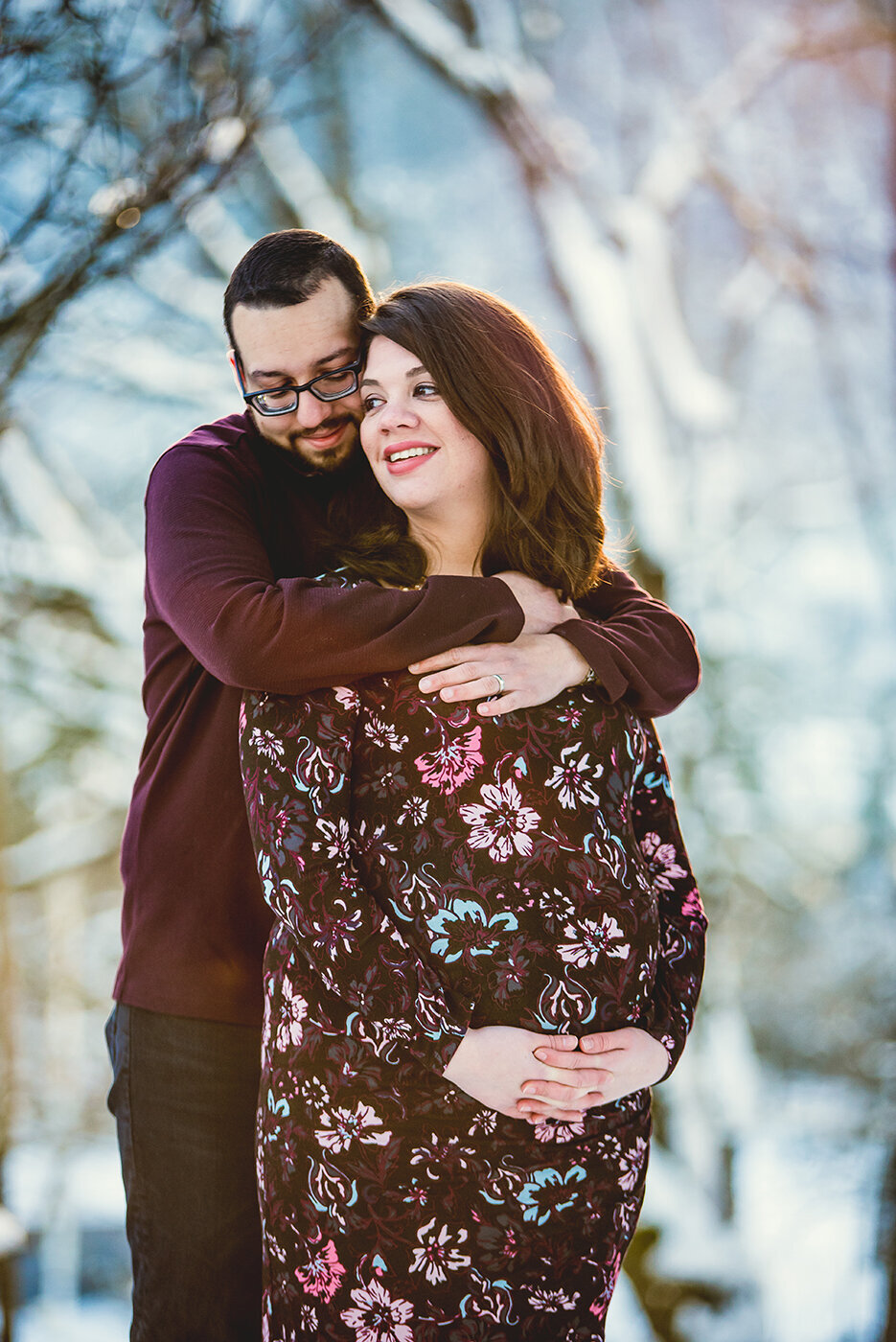 pregnant couple hugging