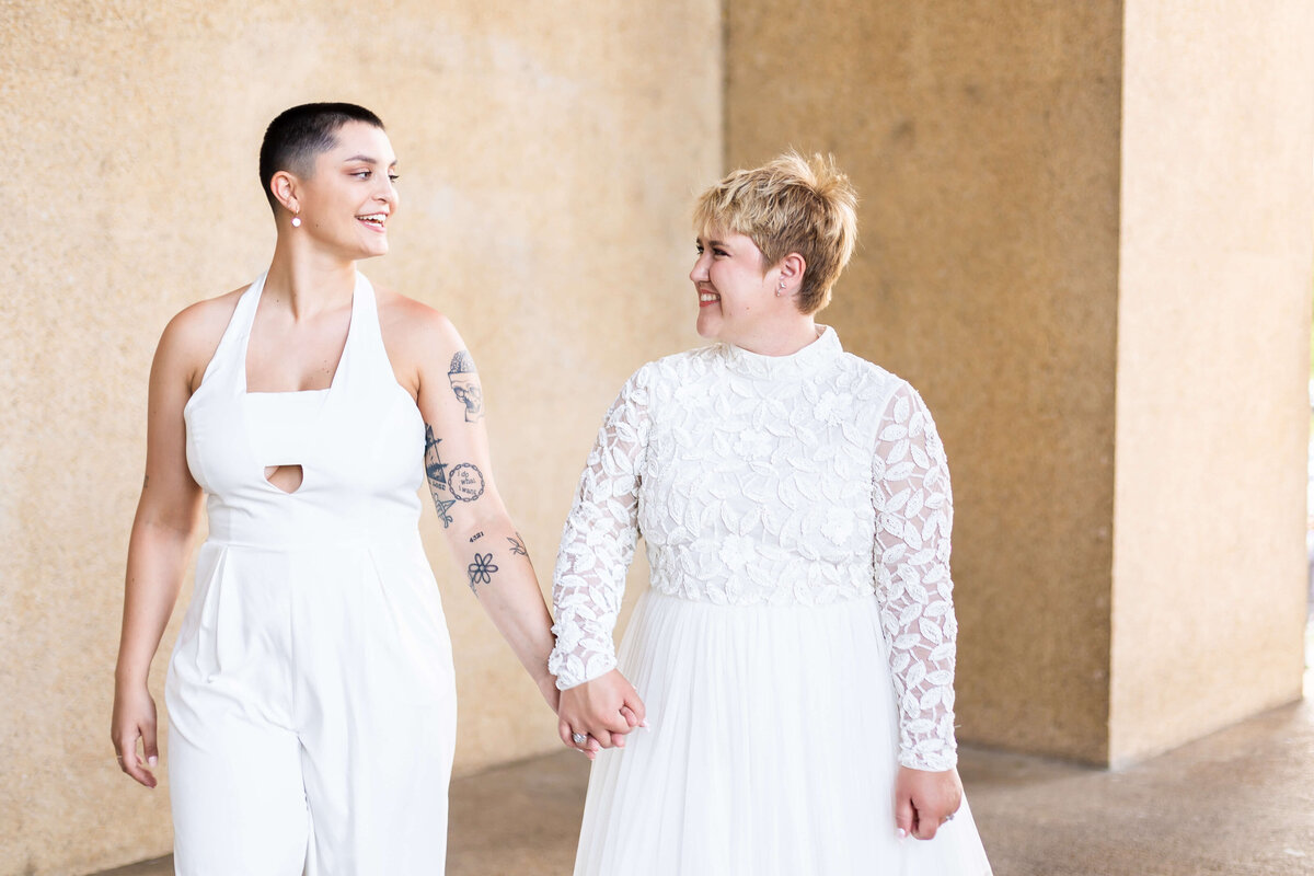 Brides wearing white outfits at LGTBQ wedding in Centennial Park, Nashville,TN
