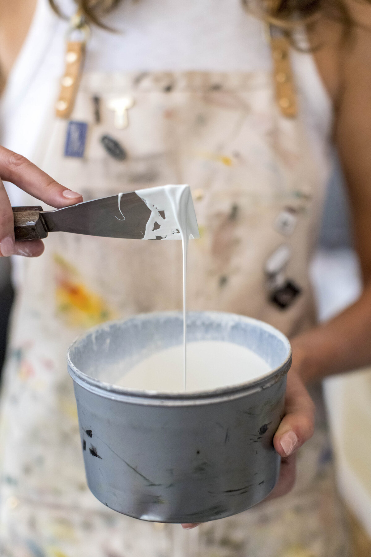 Person mixing paint