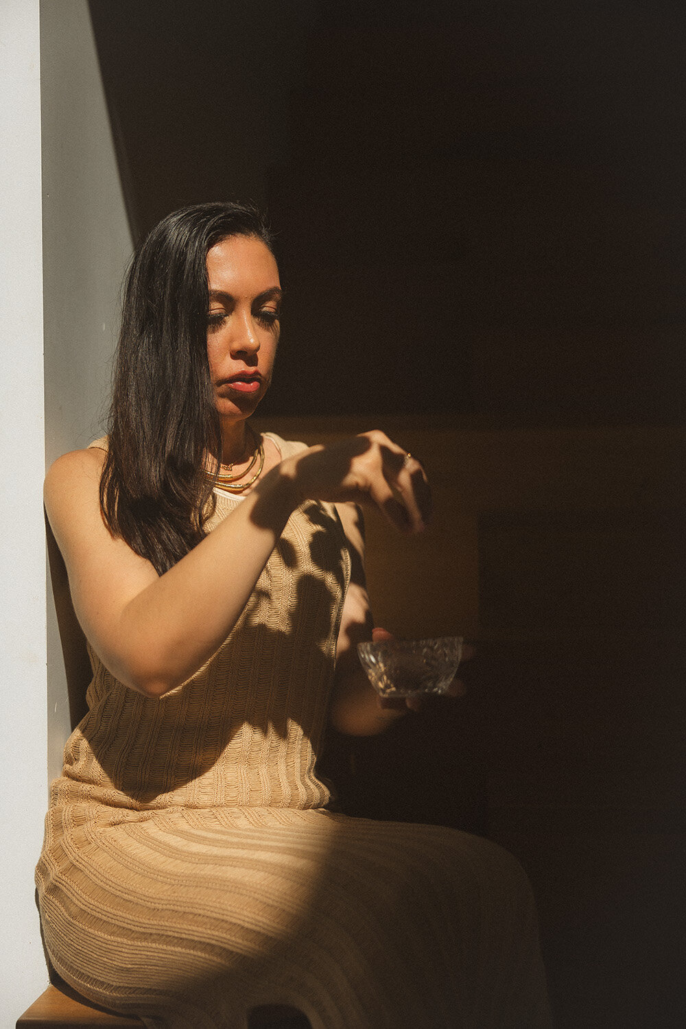 Intentional and grounded branding photo of a woman with tea, captured in a warm setting by a Sunshine Coast branding photographer.
