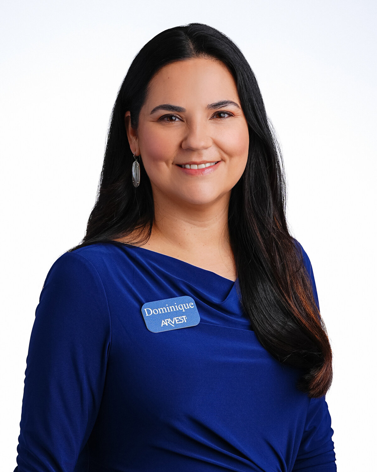 kansas-city-headshot_backdrop-standard-photography-0106-woman-in-blue-top-with-name-badge-headshot