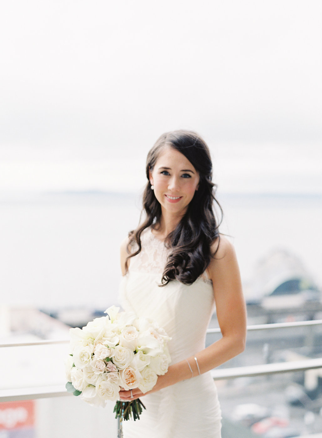 bride with white bridal bouquet