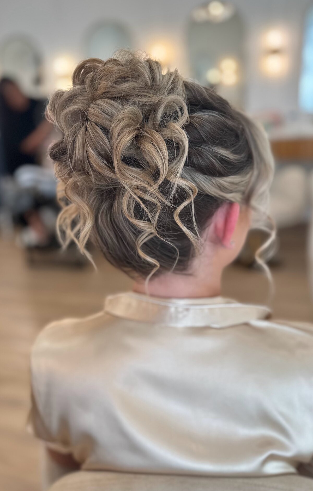 best bridal hairstylist in Nashville. high messy updo on blonde hair. curly updo