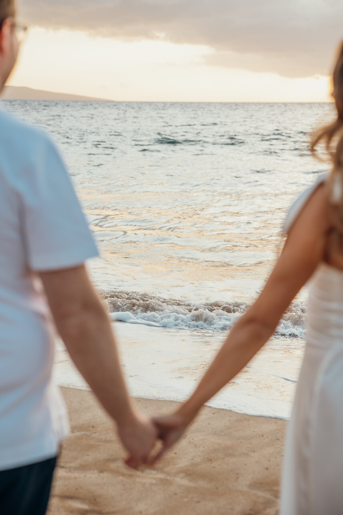Hawaii Engagement Photographer captures couple watching waves
