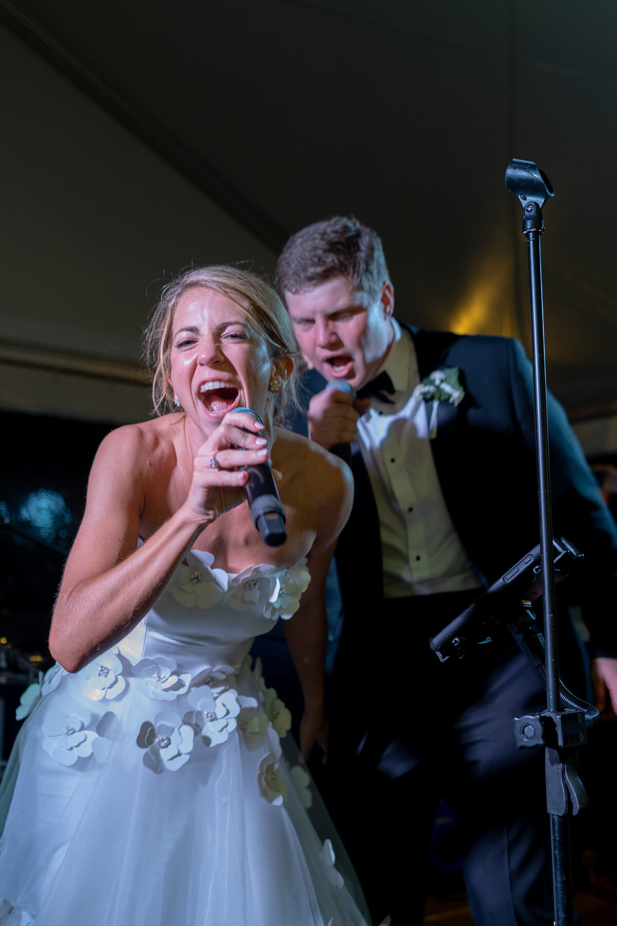 Bride sings onstage at Peachtree Golf Club Wedding