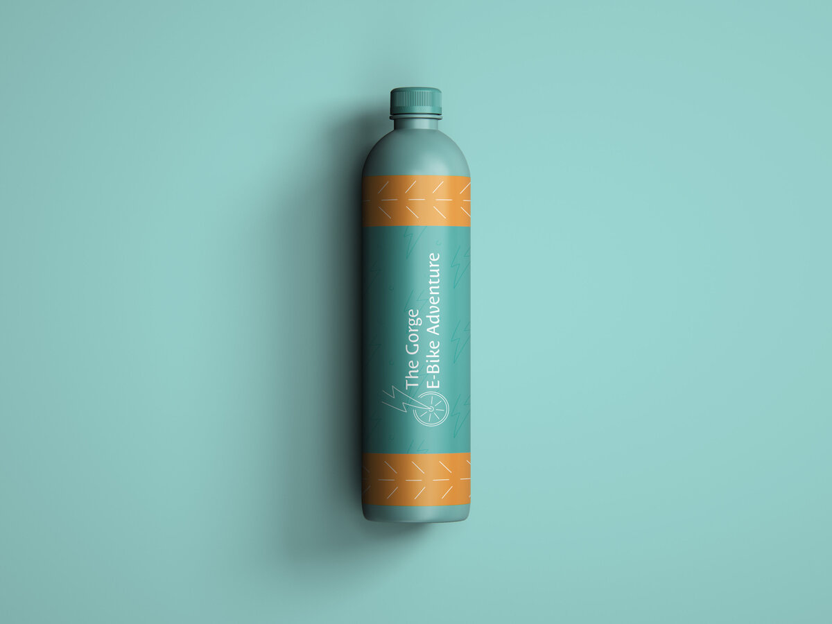 The Gorge E BIke Adventure Rentals branded water bottle on a light teal background