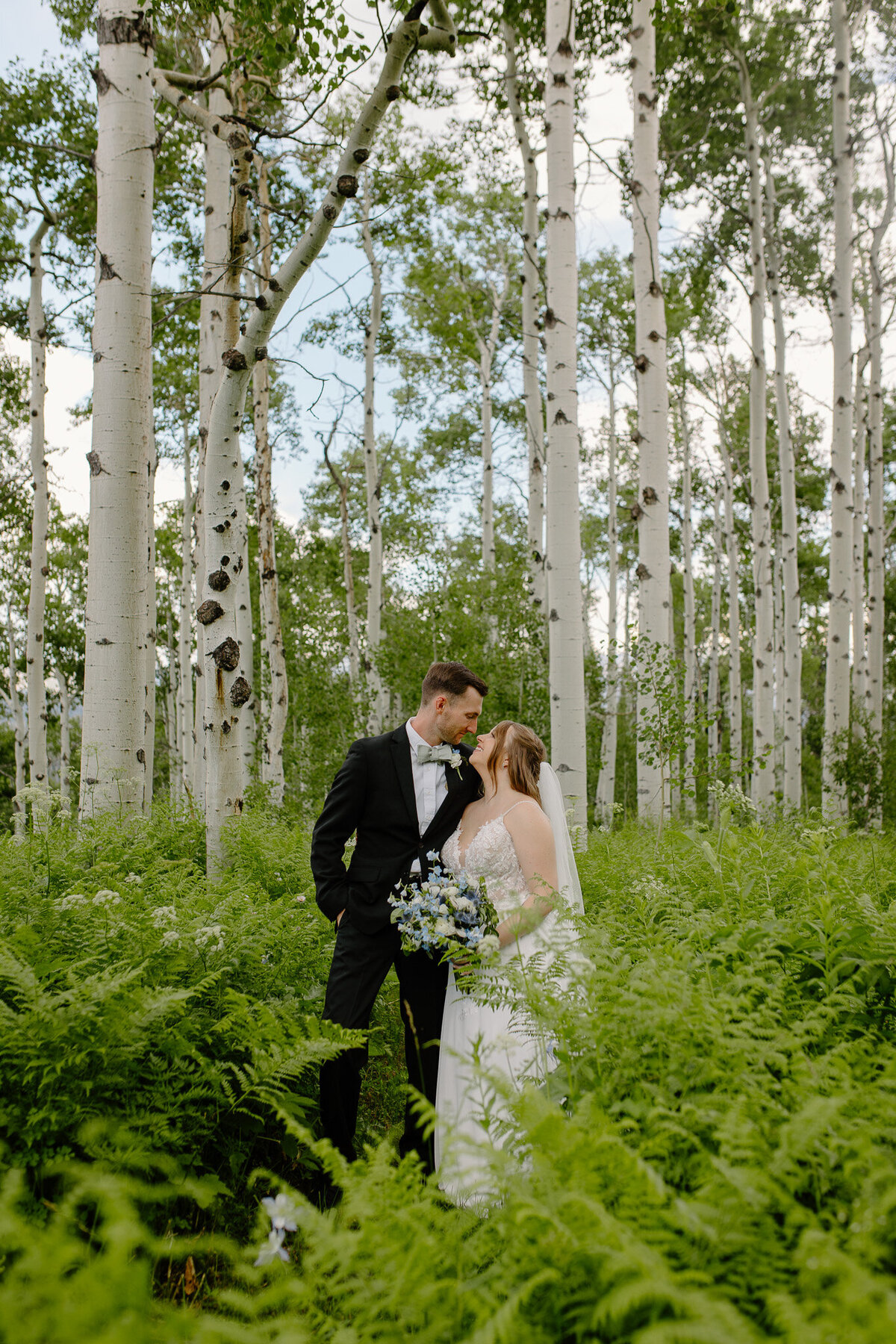 A bride and groom embrace in Crested Butte, Colorado.